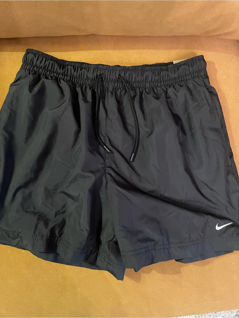Nike Women's Black Mesh Athletic Shorts with White Swoosh